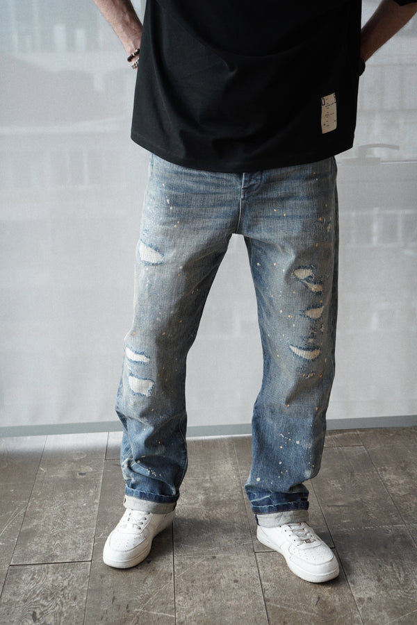 relaxed fit denim jeans with selvedge. dark destroyed wash