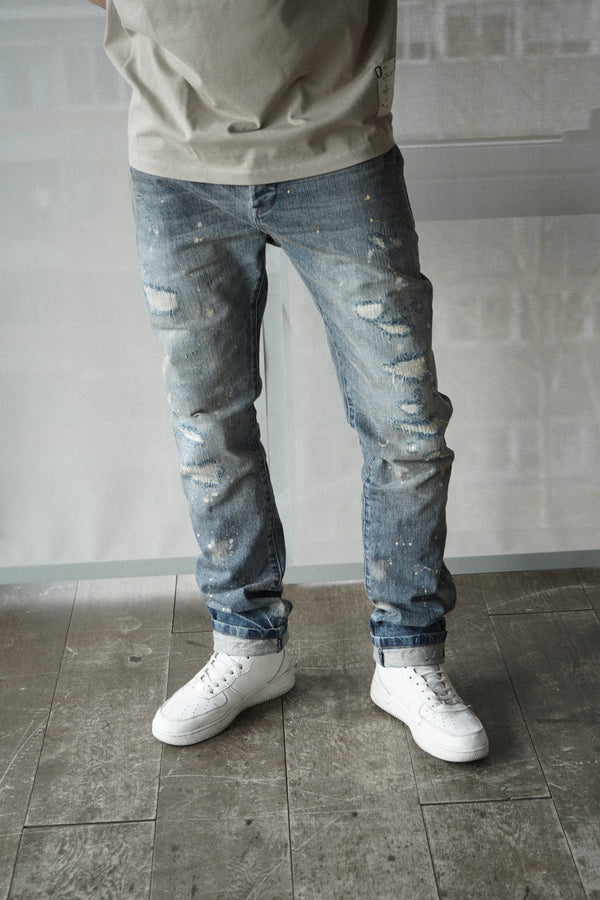 slim fit denim jeans with selvedge. dark destroyed wash